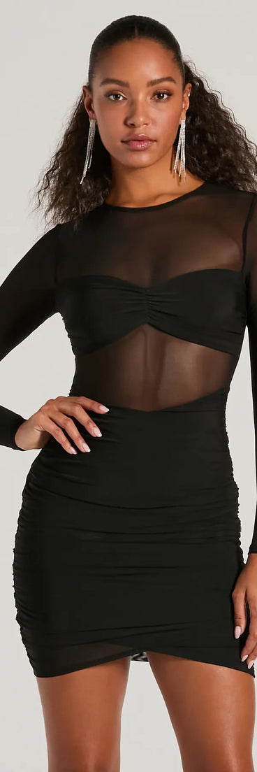Step into winter chic with the Major VIP Long Sleeve Sheer Mesh Bodycon Mini Dress, a black mini dress featuring an above-the-knee cut ideal for cocktail parties, festive gatherings, or clubwear.