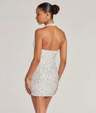 Revamp your 2025 wardrobe with this chic addition, the Forever Sparkling V-Neck Halter Rhinestone Mini Dress in white, perfect for elevating your style in the new year.