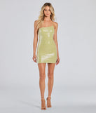 Make a bold statement in the Luxe Pose One-Shoulder Cutout Sequin Mini Dress in lime green, the perfect green dress for weddings, cocktail hours, nights out, and/or seasonal celebrations.