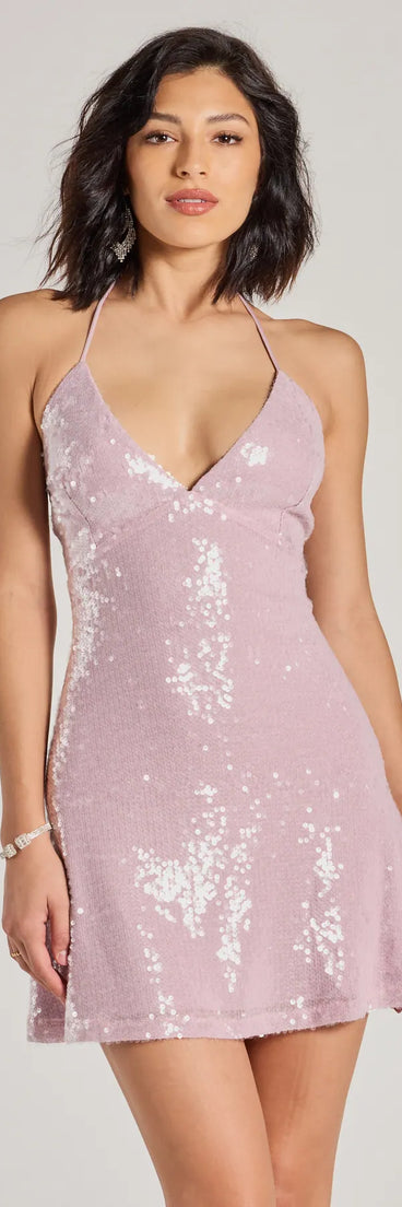Turn heads in the beaming Celebrate Good Times Sequin Halter A-Line Mini Dress, a stunning white sequin dress designed to add sparkle and elegance to your next night out or special occasion.