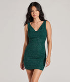 Step into winter chic with the Dancefloor Dazzler Low Back Glitter Bodycon Mini Dress, a hunter mini dress featuring an above-the-knee cut ideal for cocktail parties, festive gatherings, or clubwear.