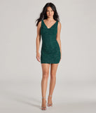 The Dancefloor Dazzler Low Back Glitter Bodycon Mini Dress is a stunning hunter mini dress with a short hem, designed to be the perfect winter cocktail dress or night-out look for the holiday season.