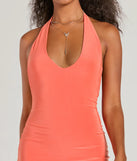 Make a bold statement in the Sultry Moves Plunging Halter Bodycon Mini Dress in orange, the perfect fall dress for weddings, cocktail hours, nights out, and/or seasonal celebrations.