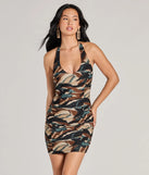The Style Sensation V-Neck Halter Abstract Mini Dress is a mini dress that will make a statement with its short hemline and on-trend details to have you ready for any event!