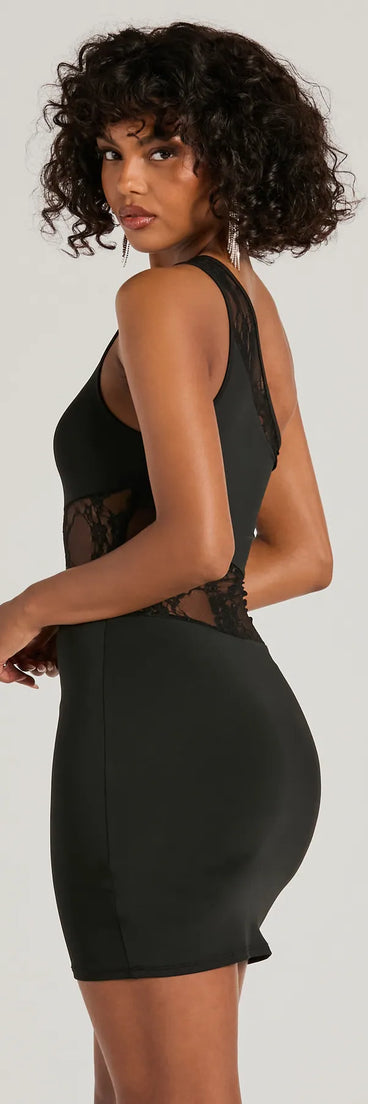 The Sweet Yet Sexy One-Shoulder Lace Mini Dress is a mini dress in black, perfect for an above-the-knee holiday party dress or a stylish NYE look, with a short hemline designed to make a winter statement.
