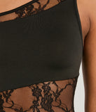 Step into winter chic with the Sweet Yet Sexy One-Shoulder Lace Mini Dress, a black mini dress featuring an above-the-knee cut ideal for cocktail parties, festive gatherings, or clubwear.