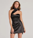 Step into winter chic with the On The Guest List Strapless Lace-Up Satin Mini Dress, a black mini dress featuring an above-the-knee cut ideal for cocktail parties, festive gatherings, or clubwear.