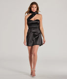 The On The Guest List Strapless Lace-Up Satin Mini Dress is a stunning black mini dress with a short hem, designed to be the perfect winter cocktail dress or night-out look for the holiday season.