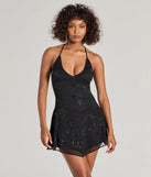 Step into seasonal chic with the Glam Drama Rhinestone Mesh A-Line Mini Dress, a raisin purple mini dress featuring an above-the-knee cut ideal for cocktail parties, festive gatherings, or clubwear.