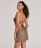 The Iconic Allure Faux Leather Strapless Bodycon Mini Dress is a mini dress in sea foam, perfect for an above-the-knee holiday party dress or a stylish NYE look, with a short hemline designed to make a winter statement.