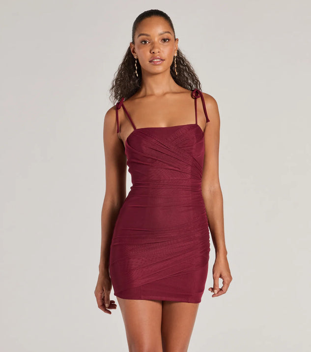 Step into seasonal chic with the Glamorous Nights Mesh And Crepe Ruched Mini Dress, a raisin purple mini dress featuring an above-the-knee cut ideal for cocktail parties, festive gatherings, or clubwear.