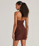 The Serving Looks Ruched Knit Bodycon Mini Dress is a mini dress in brown, perfect for an above-the-knee holiday party dress or a stylish NYE look, with a short hemline designed to make a winter statement.