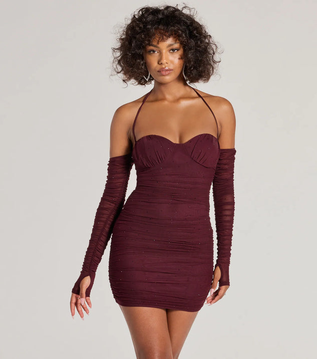 Step into seasonal chic with the Glam Instinct Cold Shoulder Rhinestone Mini Dress, a raisin purple mini dress featuring an above-the-knee cut ideal for cocktail parties, festive gatherings, or clubwear.