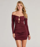 Step into winter chic with the So Sultry Off-The-Shoulder Plunge Cutout Mini Dress, a wine mini dress featuring an above-the-knee cut ideal for cocktail parties, festive gatherings, or clubwear.