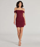 Make a bold statement in the Glam Affair Cold-Shoulder Glitter Mesh Mini Dress in wine, the perfect summer dress for weddings, cocktail hours, nights out, and/or seasonal celebrations.