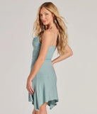 Revamp your 2025 wardrobe with this chic addition, the Glitter Babe Asymmetric A-Line Mini Dress in sage green, perfect for elevating your style in the new year.