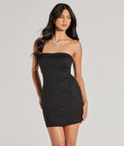 Step into seasonal chic with the Under The Spotlight Sleeveless Glitter Mini Tube Dress, a black mini dress featuring an above-the-knee cut ideal for cocktail parties, festive gatherings, or clubwear.