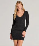 Step into seasonal chic with the Perfect Shine Glitter Knit Long Sleeve Mini Dress, a black mini dress featuring an above-the-knee cut ideal for cocktail parties, festive gatherings, or clubwear.