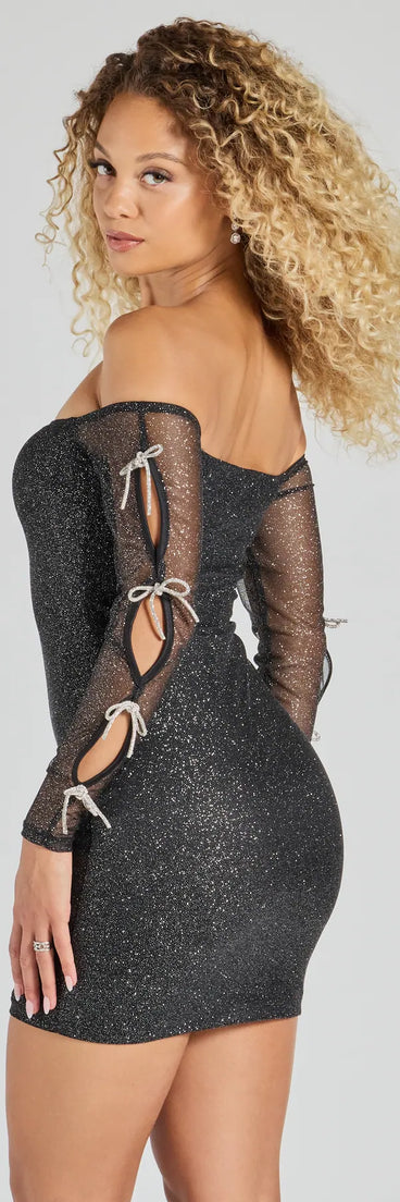Flaunt your silhouette in the tight Endless Shine Rhinestone Bow Glitter Mesh Mini Dress in black, a bodycon dress that empowers your look with bold style and effortless edge.