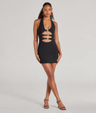 Step into winter chic with the Bold Cutie Halter Buckle Crepe Mini Dress, a black mini dress featuring an above-the-knee cut ideal for cocktail parties, festive gatherings, or clubwear.