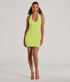Make a bold statement in the Sultry Moves Plunging Halter Bodycon Mini Dress in lime green, the perfect green dress for weddings, cocktail hours, nights out, and/or seasonal celebrations.