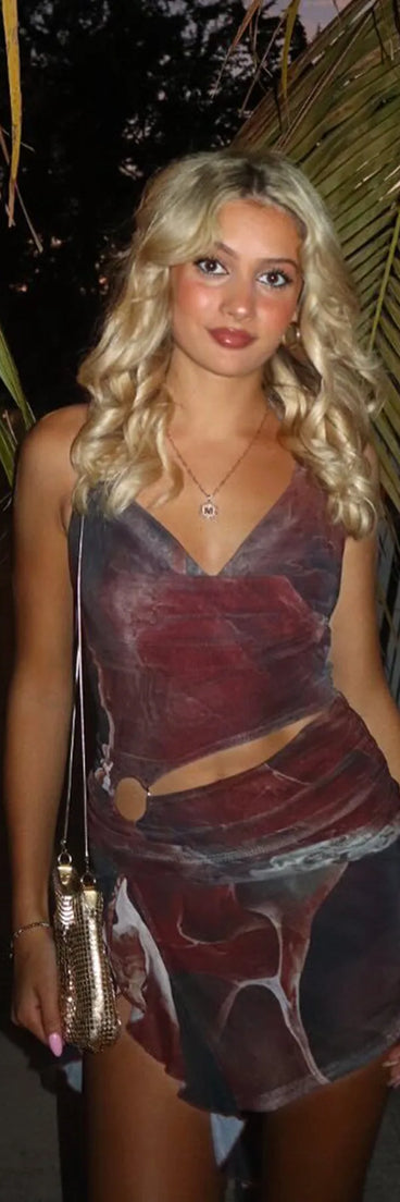 Flaunt your silhouette in the tight Daring Diva Abstract Print Cutout Halter Mini Dress in wine, a bodycon dress that empowers your look with bold style and effortless edge.