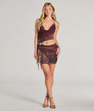 Make a bold statement in the Daring Diva Abstract Print Cutout Halter Mini Dress in wine, the perfect spring dress for weddings, cocktail hours, nights out, and/or seasonal celebrations.
