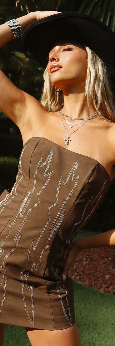 Make a bold statement in the Western Baddie Strapless Lace-Up Mini Dress in brown, the perfect fall dress for weddings, cocktail hours, nights out, and/or seasonal celebrations.