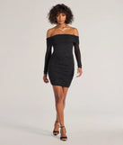 Make a bold statement in the Pop Of Glam Long Sleeve Glitter Mini Dress in black, the perfect spring dress for weddings, cocktail hours, nights out, and/or seasonal celebrations.