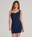 Step into seasonal chic with the Sultry Glamour Glitter Knit Bodycon Mini Dress, a navy mini dress featuring an above-the-knee cut ideal for cocktail parties, festive gatherings, or clubwear.