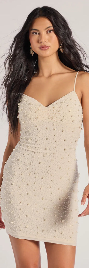 Delicate Glam Faux Pearl Sleeveless Mini Dress, a trendy ivory mini dress featuring modern details and a fresh seasonal hue, perfect for creating chic 2025 looks.