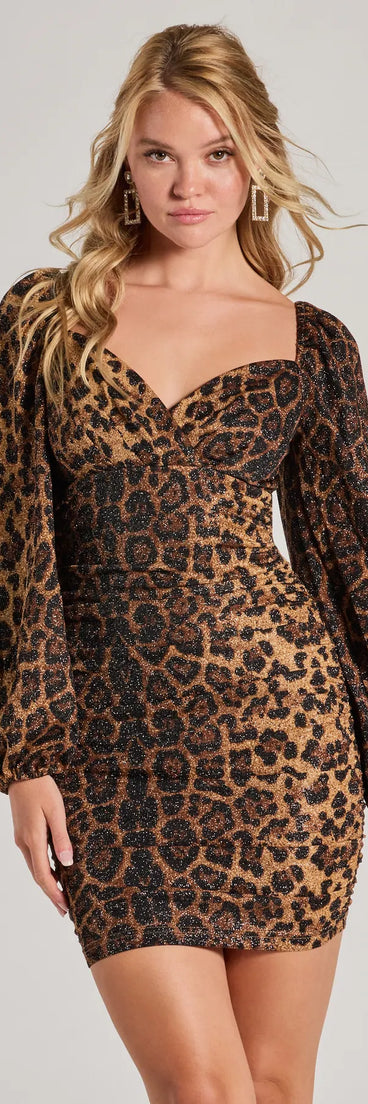 Make a bold statement in the Untamed Glamour Leopard Print Long Sleeve Mini Dress in brown, the perfect summer dress for weddings, cocktail hours, nights out, and/or seasonal celebrations.