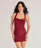 Step into seasonal chic with the Cross Your Mind X-Back Short Dress, a burgundy mini dress featuring an above-the-knee cut ideal for cocktail parties, festive gatherings, or clubwear.