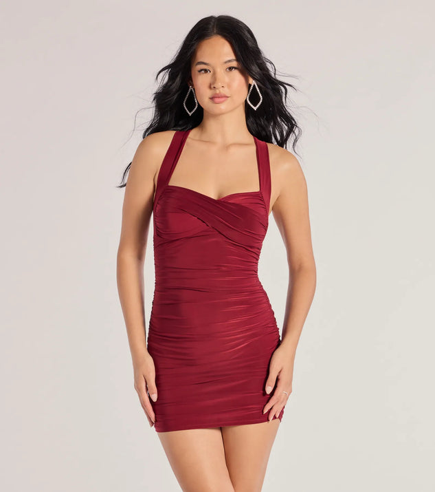 Step into seasonal chic with the Cross Your Mind X-Back Short Dress, a burgundy mini dress featuring an above-the-knee cut ideal for cocktail parties, festive gatherings, or clubwear.