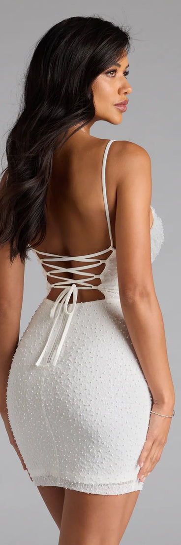 Bring high-impact style to your nightlife in the Forever Dazzline Lace-Up Sequin Bead Mini Dress, a bold white club dress made for dancing, parties, and unforgettable nights.