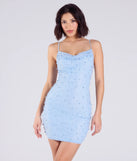 Make a bold statement in the Sensuous Sultry Faux Pearl Rhinestone Mini Dress in light blue, the perfect summer dress for weddings, cocktail hours, nights out, and/or seasonal celebrations.