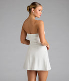 The Forever Chic Drop Waist A-line Mini Dress in white brings sleek style to any graduation outfit, from cap and gown to after-party.