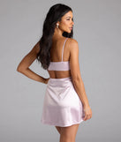 Shine with confidence, elegance, and standout style in the Gorgeous Evening Cutout Satin Mini Dress—a lavender graduation dress designed with a fresh silhouette and the latest trends.