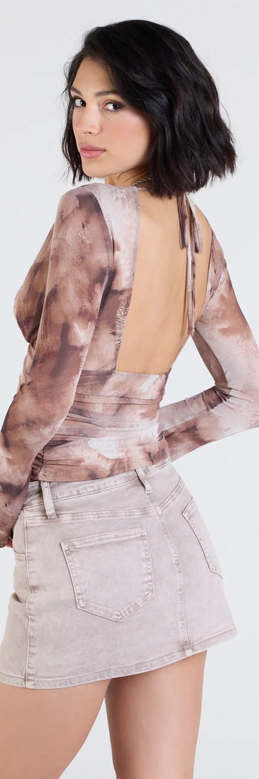 From bold to effortless, the Trending Adoration Plunge Neck Print Crop Top lets you define your vibe with brown tops that speak your style.