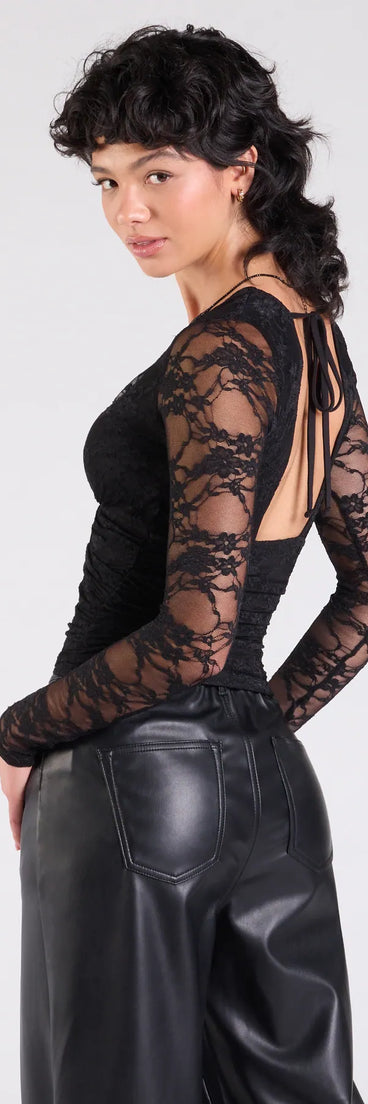Add a sleek touch to your outfit with this black long sleeve top—the Sultry And Chic Sheer Lace Long Sleeve Top makes effortless transitions from desk to dinner.