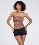 The Wildly Charming Snake Print Crop Top in brown brings edge and energy to your vibe, ready to elevate any festival look or concert outfit.