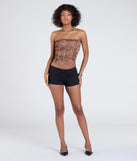 With its midriff cut and trend-forward fit, the Wildly Charming Snake Print Crop Top is a brown crop top made to pair with skirts, denim, or whatever vibe you're feeling this season.