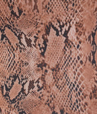 From bold to effortless, the Wildly Charming Snake Print Crop Top lets you define your vibe with brown tops that speak your style.