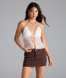 The Unforgettable Babe Sheer Lace Crop Top in white brings edge and energy to your vibe, ready to elevate any festival look or concert outfit.