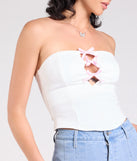Stay on-trend this season with the Lookin' Cute Bow-Trim Cutout Top in white, a must-have for creating stylish and effortless summer outfits for women.