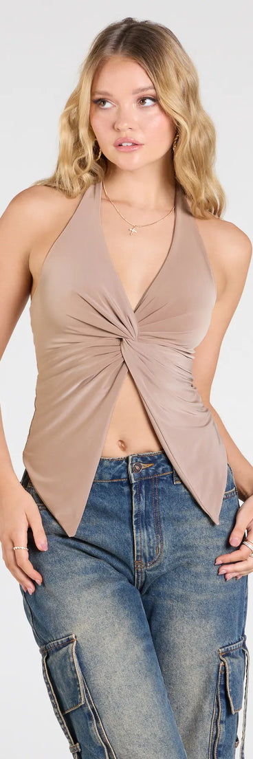 The Routinely Cute Halter Knot Crop Top in tan brings edge and energy to your vibe, ready to elevate any festival look or concert outfit.
