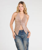 The Routinely Cute Halter Knot Crop Top in tan brings edge and energy to your vibe, ready to elevate any festival look or concert outfit.