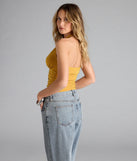 With its midriff cut and trend-forward fit, the Viva La Friday Halter Crop Top is a mustard yellow crop top made to pair with skirts, denim, or whatever vibe you're feeling this season.