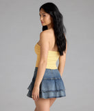 With its midriff cut and trend-forward fit, the Posh And Pretty Strapless Bow Ponte Crop Top is a yellow crop top made to pair with skirts, denim, or whatever vibe you're feeling this season.