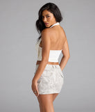 With its midriff cut and trend-forward fit, the Take The Plunge Sleeveless Halter Crop Top is a ivory crop top made to pair with skirts, denim, or whatever vibe you're feeling this season.
